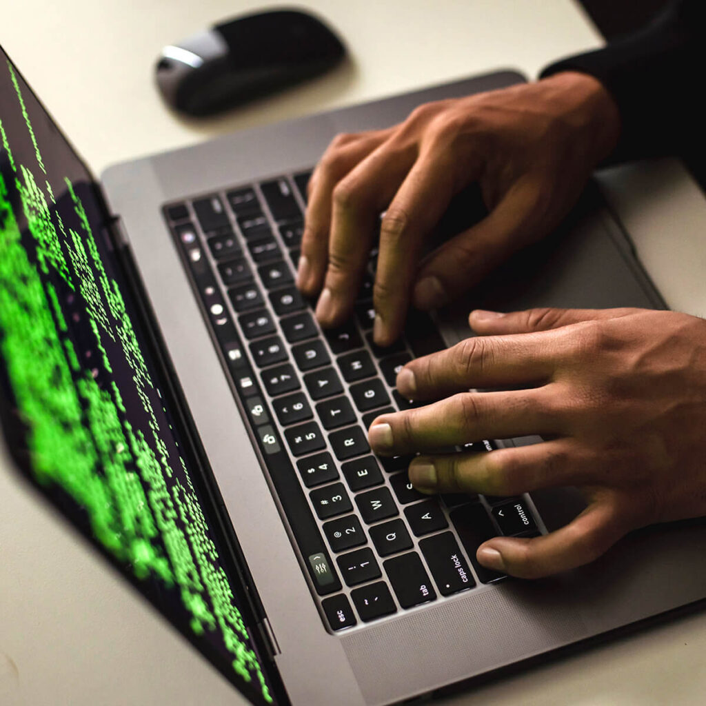 man researching on a laptop computer